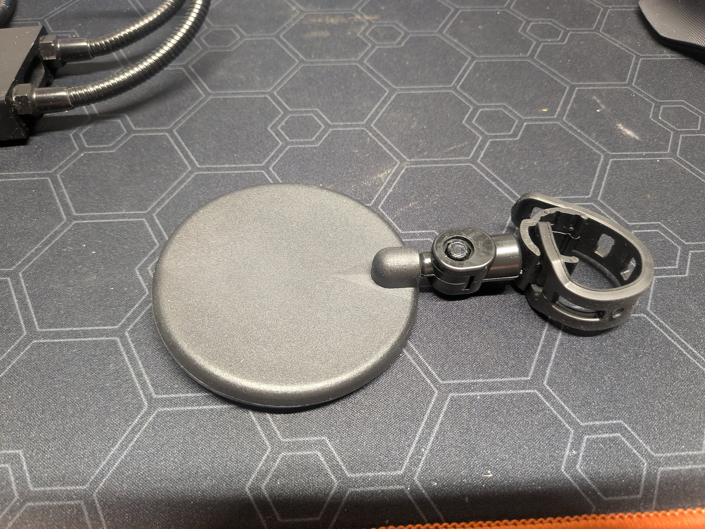 Small rotating strap on mirror