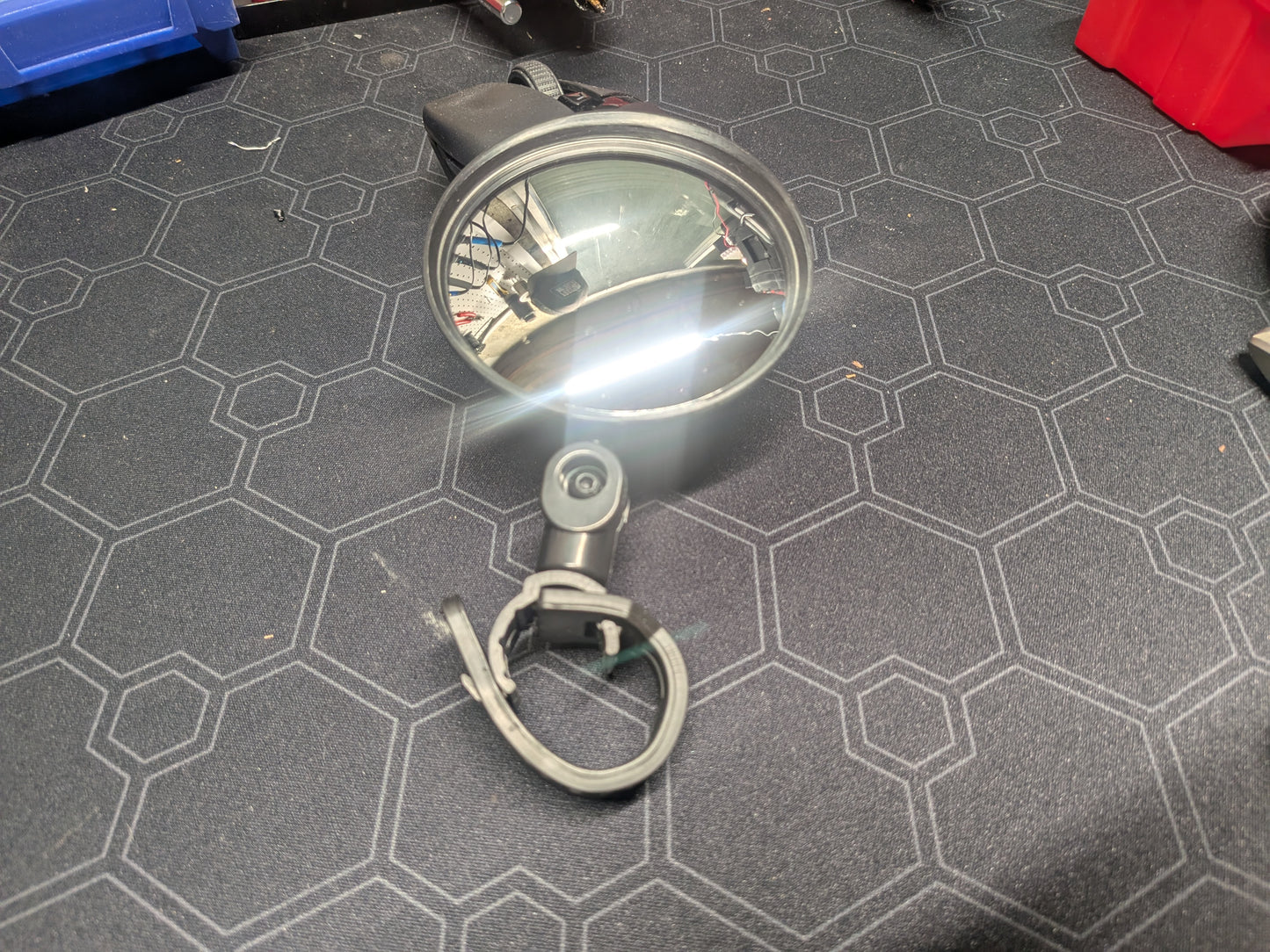 Small rotating strap on mirror