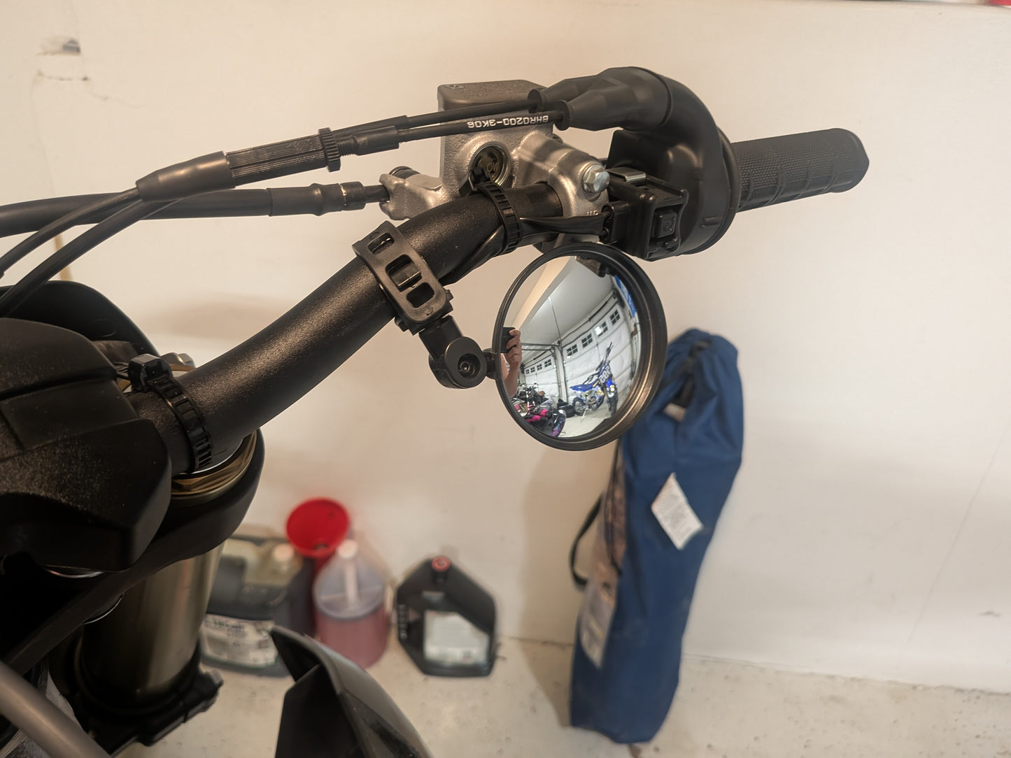 Rotating strap on mirror