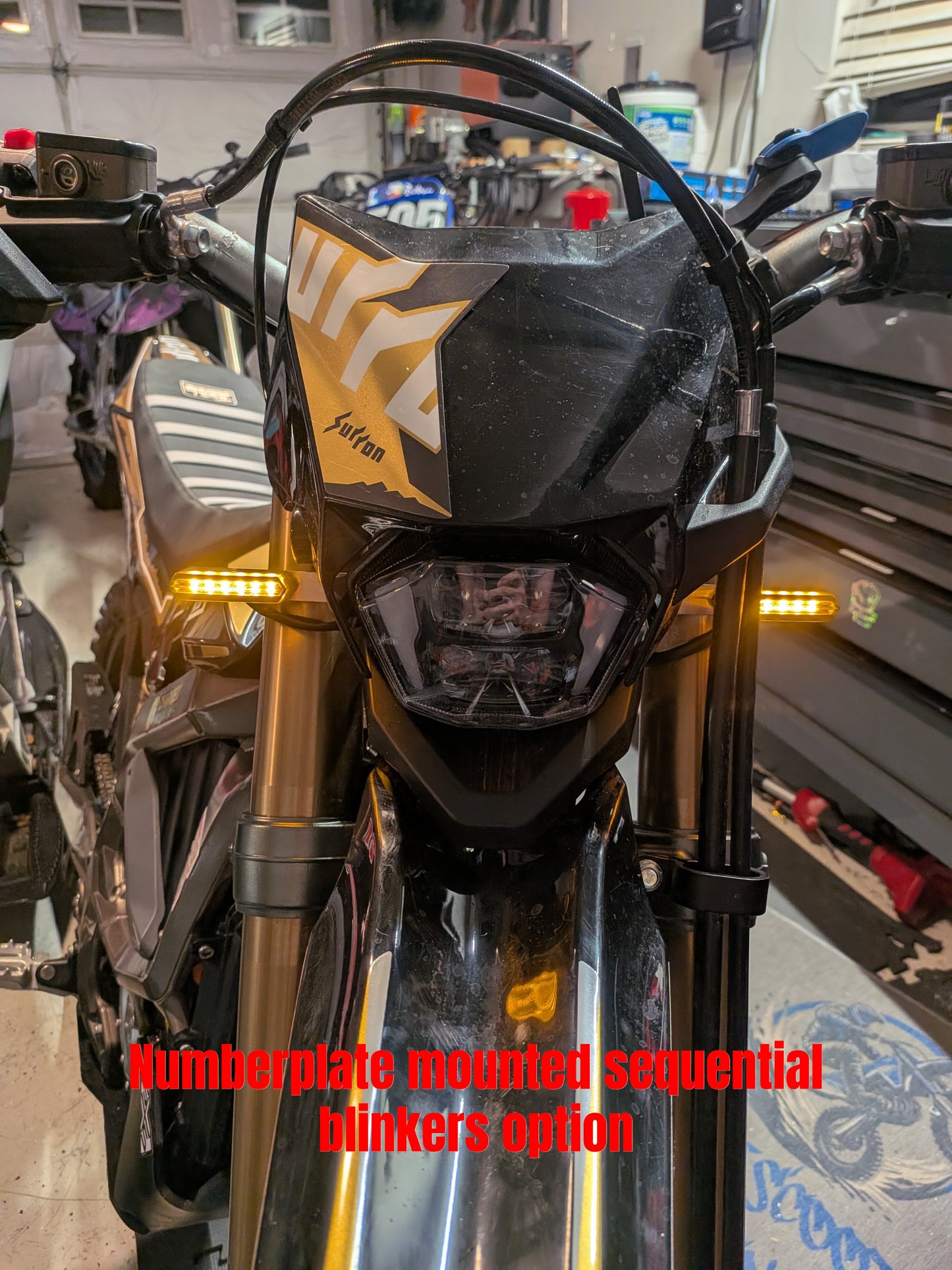 Numberplate mounted front turn signals